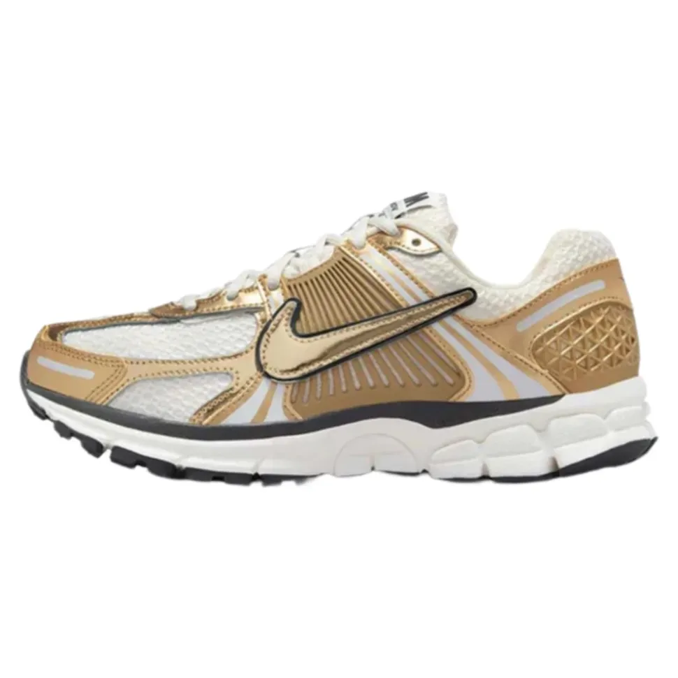 Zapatilla de running mujer oro metálico